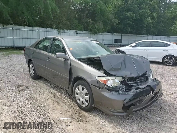 2004 Toyota Camry LE z VIN 4T1BE32K74U848946, wystawiony jako Copart lot #56030995 z przebiegiem Nie podano mil oraz Szkoda całkowita • Salvage title. Historia ofert i sprzedaży dostępna na DreamBid. Obrazek 13.