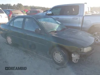 1999 Mitsubishi Mirage DE z VIN JA3AY26A0XU017889, wystawiony jako IAAI lot #40457172 z przebiegiem Nie podano mil oraz . Historia ofert i sprzedaży dostępna na DreamBid. Obrazek 1.