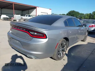 2015 Dodge Charger SXT with VIN 2C3CDXHG8FH884080, listed as a IAAI auction lot 42230385 with 151,948 mi miles and . Bid and sale history available at DreamBid. Image 4.