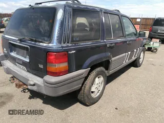1994 Jeep Grand Cherokee Laredo with VIN 1J4GZ58Y3RC202638, listed as a IAAI auction lot 41885484 with 164,481 mi miles. Bid and sale history available at carsss.com. Image 4.