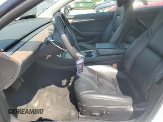 2023 Tesla Model 3 with VIN 5YJ3E1EA8PF449797, listed as a Copart auction lot 64601115 with 99,771 mi miles and Clean title. Bid and sale history available at DreamBid. Image 7.