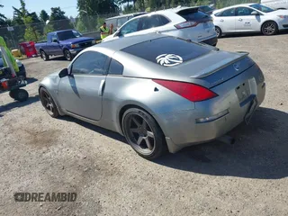 2003 Nissan 350Z Touring z VIN JN1AZ34E03T004458, wystawiony jako IAAI lot #42361684 z przebiegiem 147 847 mil mil oraz . Historia ofert i sprzedaży dostępna na DreamBid. Obrazek 3.