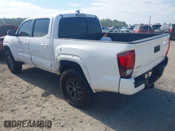 2023 Toyota Tacoma SR with VIN 3TYCZ5AN2PT112854, listed as a IAAI auction lot 42220025 with 43,657 mi miles and . Bid and sale history available at DreamBid. Image 3.