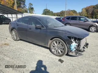2021 Mazda 6 Signature with VIN JM1GL1XY0M1617051, listed as a Copart auction lot 76715774 with 43,925 mi miles and Salvage Title. Bid and sale history available at DreamBid. Image 4.