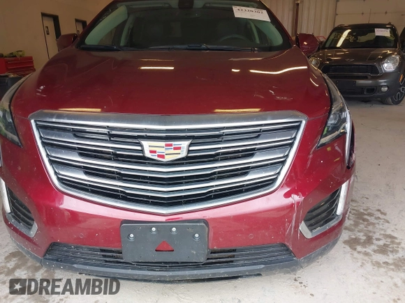 2018 Cadillac XT5 Premium Luxury AWD z VIN 1GYKNFRS6JZ114464, wystawiony jako IAAI lot #42320302 z przebiegiem 61 231 mil mil oraz . Historia ofert i sprzedaży dostępna na DreamBid. Obrazek 12.