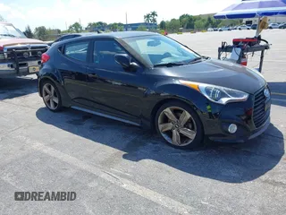 2014 Hyundai Veloster Turbo with VIN KMHTC6AE2EU184967, listed as a IAAI auction lot 41780186 with 104,822 mi miles and . Bid and sale history available at DreamBid. Image 1.