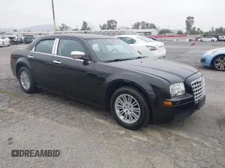 2009 Chrysler 300 LX with VIN 2C3KA43D19H506753, listed as a IAAI auction lot 42053199 with 106,092 mi miles. Bid and sale history available at carsss.com. Image 1.