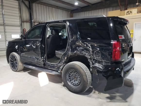 2018 Chevrolet Tahoe LS with VIN 1GNSKAKC4JR321530, listed as a Copart auction lot 43057985 with 104,553 mi miles and Salvage Title. Bid and sale history available at carsss.com. Image 2.
