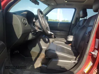 2015 Jeep Patriot High Altitude with VIN 1C4NJRFBXFD272296, listed as a Copart auction lot 62051095 with 118,496 mi miles and Salvage title. Bid and sale history available at DreamBid. Image 7.