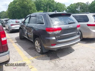2020 Jeep Grand Cherokee Summit with VIN 1C4RJFJT0LC137054, listed as a IAAI auction lot 42235704 with 70,000 mi miles and . Bid and sale history available at DreamBid. Image 3.