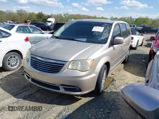 2013 Chrysler Town & Country Touring with VIN 2C4RC1BG8DR559824, listed as a IAAI auction lot 41818237 with 211,248 mi miles. Bid and sale history available at carsss.com. Image 2.