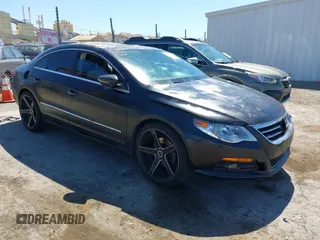 2009 Volkswagen CC Luxury z VIN WVWHL73C19E551417, wystawiony jako IAAI lot #42324317 z przebiegiem 99 410 mil mil oraz . Historia ofert i sprzedaży dostępna na DreamBid. Obrazek 1.