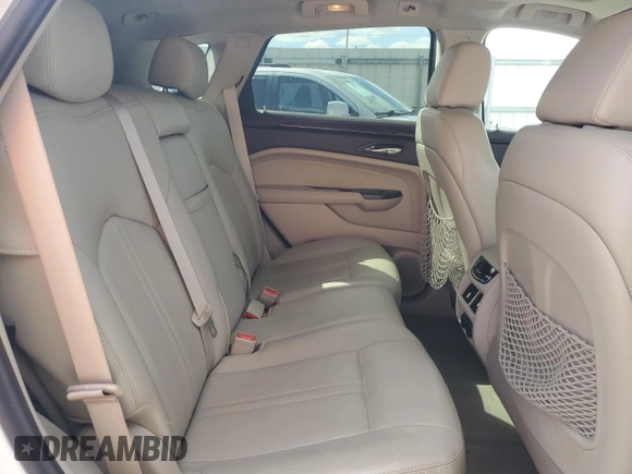 2014 Cadillac SRX Premium Collection z VIN 3GYFNGE32ES573872, wystawiony jako Copart lot #49871955 z przebiegiem 119 362 mil mil oraz Szkody całkowita. Historia ofert i sprzedaży dostępna na DreamBid. Obrazek 11.