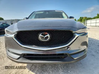 2020 Mazda CX-5 Grand Touring z VIN JM3KFADM2L0803589, wystawiony jako Copart lot #61916825 z przebiegiem 63 663 mil mil oraz Szkoda całkowita • Salvage title. Historia ofert i sprzedaży dostępna na DreamBid. Obrazek 5.