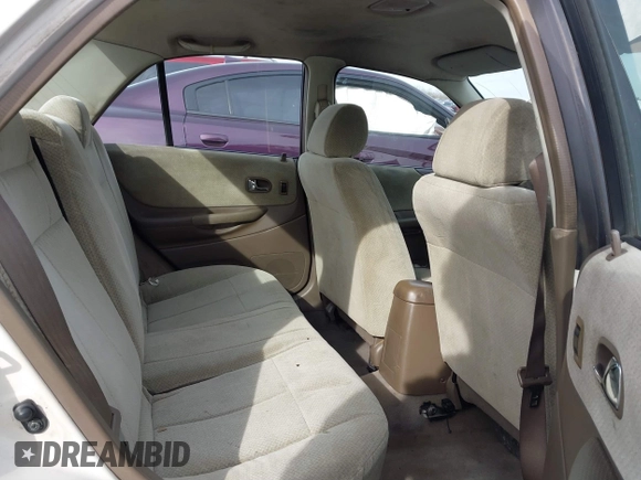 2000 Mazda Protege DX with VIN JM1BJ2221Y0208156, listed as a IAAI auction lot 41609657 with 435,304 mi miles and . Bid and sale history available at DreamBid. Image 8.