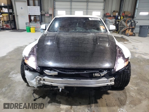 2012 Nissan 370Z z VIN JN1AZ4EH2CM564443, wystawiony jako Copart lot #45126885 z przebiegiem 71 729 mil mil oraz Szkody całkowita. Historia ofert i sprzedaży dostępna na DreamBid. Obrazek 5.
