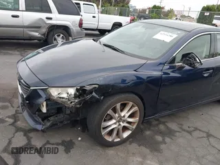 2016 Mazda 6 i Touring z VIN JM1GJ1V50G1401865, wystawiony jako IAAI lot #42334286 z przebiegiem 148 593 mil mil oraz . Historia ofert i sprzedaży dostępna na DreamBid. Obrazek 6.