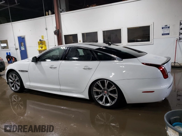 2015 Jaguar XJ with VIN SAJWJ1CD3F8V89374, listed as a Copart auction lot 49416114 with 94,636 mi miles and . Bid and sale history available at DreamBid. Image 2.