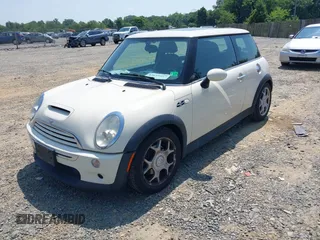 2006 MINI Hardtop S with VIN WMWRE33596TJ37959, listed as a IAAI auction lot 42635457 with 124,440 mi miles and . Bid and sale history available at DreamBid. Image 2.