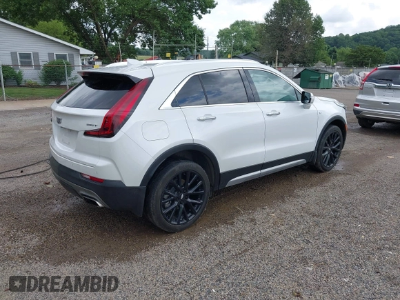 2022 Cadillac XT4 AWD Premium Luxury z VIN 1GYFZDR42NF128199, wystawiony jako IAAI lot #42522314 z przebiegiem 29 002 mil mil oraz . Historia ofert i sprzedaży dostępna na DreamBid. Obrazek 4.