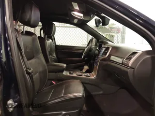 2017 Jeep Grand Cherokee Overland with VIN 1C4RJFCG3HC693897, listed as a IAAI auction lot 41636323 with 105,575 mi miles. Bid and sale history available at carsss.com. Image 5.