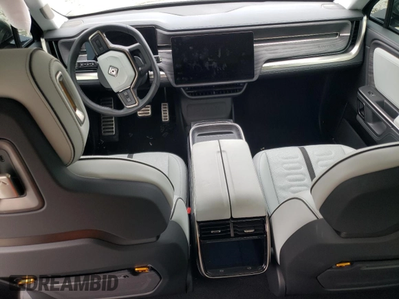 2024 Rivian R1T Adventure z VIN 7FCTGCAA1RN030829, wystawiony jako Copart lot #81459854 z przebiegiem Nie podano mil oraz Szkody całkowita. Historia ofert i sprzedaży dostępna na DreamBid. Obrazek 8.