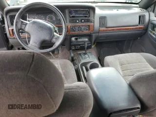1996 Jeep Grand Cherokee with VIN 1J4EZ58S8TC106529, listed as a Copart auction lot 50163965 with 226,951 mi miles and Salvage title. Bid and sale history available at DreamBid. Image 8.