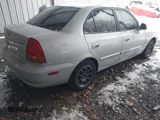 2005 Hyundai Accent GLS with VIN KMHCG45C75U656548, listed as a IAAI auction lot 41553603 with 178,070 mi miles. Bid and sale history available at carsss.com. Image 4.