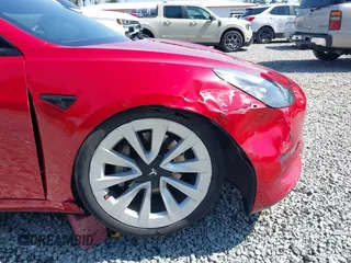 2021 Tesla Model 3 Long Range with VIN 5YJ3E1EB6MF054361, listed as a IAAI auction lot 42105247 with 58,986 mi miles and . Bid and sale history available at carsss.com. Image 6.