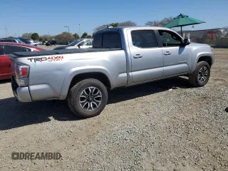 2021 Toyota Tacoma 4WD SR5 with VIN 3TMDZ5BN9MM099787, listed as a Copart auction lot 49717425 with 56,374 mi miles and Salvage Title. Bid and sale history available at carsss.com. Image 3.