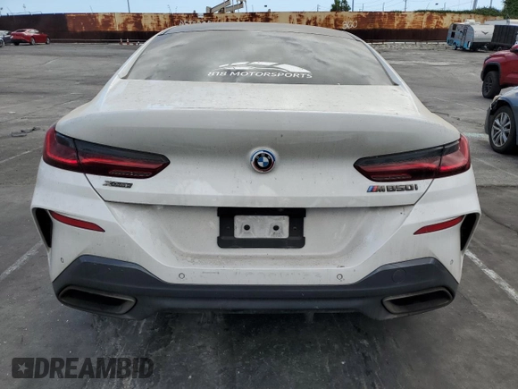 2021 BMW 8 Series M850i with VIN WBAGV8C04MCF56486, listed as a Copart auction lot 55991015 with 60,249 mi miles and Salvage title. Bid and sale history available at DreamBid. Image 6.