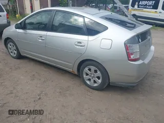 2005 Toyota Prius z VIN JTDKB20U257051452, wystawiony jako IAAI lot #42451660 z przebiegiem 166 106 mil mil oraz . Historia ofert i sprzedaży dostępna na DreamBid. Obrazek 3.
