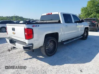 2017 Chevrolet Silverado 1500 LT with VIN 3GCUKREC4HG364108, listed as a IAAI auction lot 42050014 with 148,691 mi miles and . Bid and sale history available at DreamBid. Image 4.