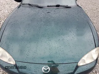 2001 Mazda MX-5 Miata z VIN JM1NB353610200693, wystawiony jako Copart lot #55385725 z przebiegiem 98 777 mil mil oraz Szkoda całkowita • Salvage title. Historia ofert i sprzedaży dostępna na DreamBid. Obrazek 11.