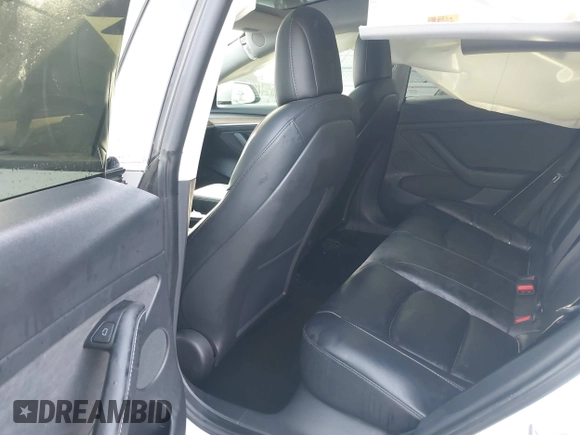 2021 Tesla Model 3 Long Range with VIN 5YJ3E1EB0MF009965, listed as a IAAI auction lot 41478233 with 31,713 mi miles and . Bid and sale history available at DreamBid. Image 8.