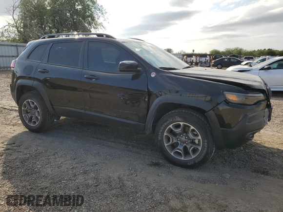 2022 Jeep Cherokee Trailhawk with VIN 1C4PJMBX8ND554044, listed as a Copart auction lot 82687464 with 13,353 mi miles and Salvage Title. Bid and sale history available at carsss.com. Image 4.