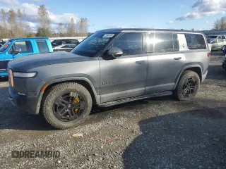 2022 Rivian R1S Launch Edition with VIN 7PDSGABL1NN000514, listed as a Copart auction lot 77444184 with 29,490 mi miles and Salvage Title. Bid and sale history available at DreamBid. Image 1.