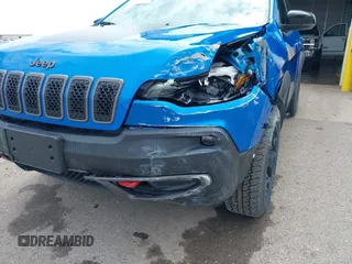 2022 Jeep Cherokee Trailhawk z VIN 1C4PJMBX4ND513488, wystawiony jako IAAI lot #42137114 z przebiegiem 12 306 mil mil oraz . Historia ofert i sprzedaży dostępna na DreamBid. Obrazek 17.