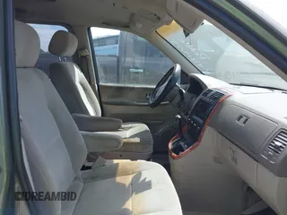 2004 Kia Sedona LX with VIN KNDUP131546549302, listed as a IAAI auction lot 41819215 with 125,881 mi miles. Bid and sale history available at carsss.com. Image 5.