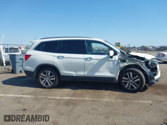 2018 Honda Pilot Touring with VIN 5FNYF6H95JB019122, listed as a IAAI auction lot 42439283 with 128,848 mi miles and . Bid and sale history available at DreamBid. Image 13.