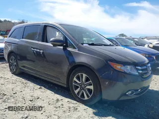 2014 Honda Odyssey Touring with VIN 5FNRL5H92EB016546, listed as a IAAI auction lot 41689148 with 143,601 mi miles and . Bid and sale history available at DreamBid. Image 13.