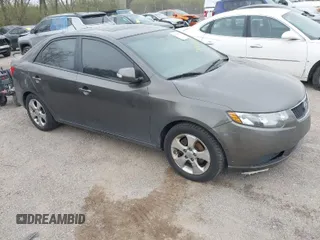 2010 Kia Forte EX with VIN KNAFU4A26A5287755, listed as a IAAI auction lot 41983578 with 273,765 mi miles. Bid and sale history available at carsss.com. Image 1.