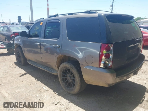 2013 GMC Yukon SLT with VIN 1GKS2CE04DR290293, listed as a IAAI auction lot 39620358 with 167,664 mi miles. Bid and sale history available at carsss.com. Image 3.