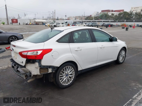2012 Ford Focus SEL with VIN 1FAHP3H27CL314291, listed as a IAAI auction lot 41859207 with 86,830 mi miles. Bid and sale history available at carsss.com. Image 4.