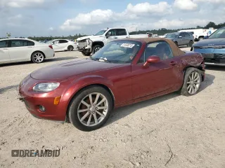2007 Mazda MX-5 Miata Sport z VIN JM1NC25F270127574, wystawiony jako Copart lot #51538215 z przebiegiem 131 339 mil mil oraz Szkody całkowita. Historia ofert i sprzedaży dostępna na DreamBid. Obrazek 1.