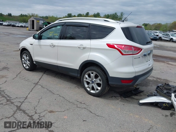 2016 Ford Escape Titanium with VIN 1FMCU9J98GUA00832, listed as a IAAI auction lot 42188941 with 90,764 mi miles and . Bid and sale history available at DreamBid. Image 3.