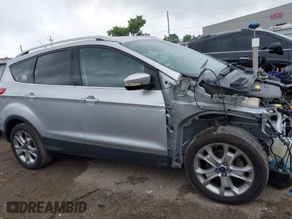 2015 Ford Escape Titanium with VIN 1FMCU0JX7FUB60418, listed as a IAAI auction lot 42485107 with 82,172 mi miles and . Bid and sale history available at DreamBid. Image 13.