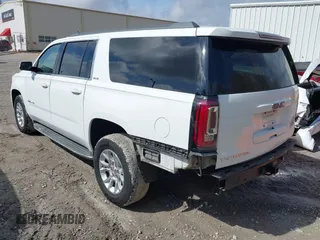 2016 GMC Yukon XL SLE with VIN 1GKS1FKC0GR331459, listed as a IAAI auction lot 41557718 with 203,803 mi miles. Bid and sale history available at carsss.com. Image 3.