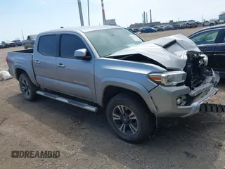 2019 Toyota Tacoma SR with VIN 5TFCZ5AN5KX195629, listed as a IAAI auction lot 42021100 with 80,991 mi miles and . Bid and sale history available at DreamBid. Image 1.