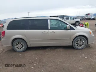 2014 Dodge Grand Caravan SXT z VIN 2C4RDGCG8ER253786, wystawiony jako IAAI lot #41771226 z przebiegiem 175 507 mil mil oraz . Historia ofert i sprzedaży dostępna na DreamBid. Obrazek 13.